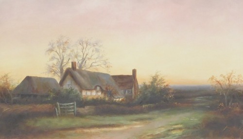 British School (Early 20thC). Thatched farmstead in a country landscape, oil on canvas, monogrammed, dated 1908, 26cm x 43cm.