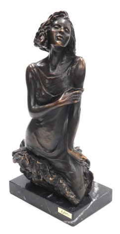 A late 20thC Andre Paor bronze sculpture of a young woman, modelled emerging from a rock raised on a rectangular marble base, signed indistinctly and bearing a foundry plaque, 38cm high.