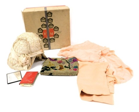 A Victorian silk and lace bonnet, together with lace trimmings, a wool work evening bag and a Fortnum and Mason 1957 hat box.