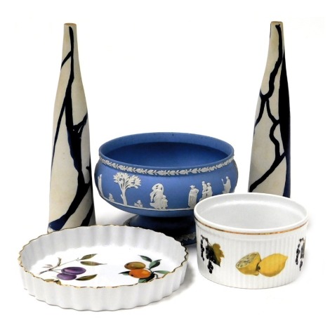 A Wedgwood light blue Jasper ware fruit bowl, sprig moulded with classical figures, Royal Worcester Evesham pattern souffle dish and flan dish, and a pair of tapering Mannerist salt and pepper shakers with blue streak decoration. (5)