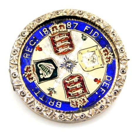 A Queen Victoria 1887 double florin enamelled brooch, in a reversible pivoting circular mount with pin.