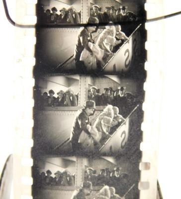 An early 20thC Bing film projector, together with a tin containing a cinematograph film. (2) - 2