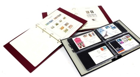 Philately. GVI-QEII mint commemoratives and definitives, 1940-1981, 1986 and 1993 in two albums, together with an album of first day covers. (3)