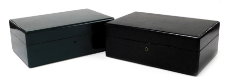 Two cigar humidor boxes, one painted in black, with key, the other in green with a three division interior, lacking key, each 14cm high, 38cm wide, 25cm deep. (2)