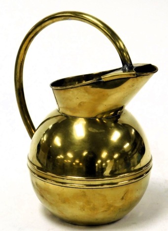 A late 19thC brass jug by Henry Loveridge, in the manner of Christopher Dresser, with a looped handle and covered spot, the bulbous body with two horizontal bands, maker's stamp and numbered 81 and 4, 29cm high.