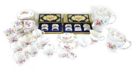 A Royal Crown Derby Posies pattern porcelain coffee service, comprising coffee pot, hot water jug, cream jug and sugar bowl, thirteen cups and saucers, together with two trinket dishes, pair of napkin rings and two sets of napkin rings, four and six respe