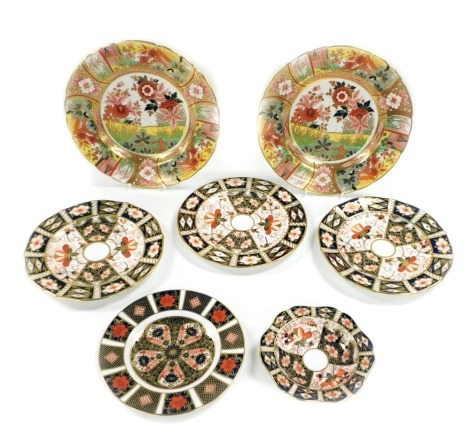 A group of Royal Crown Derby Imari porcelain plates, some seconds, comprising a pair of Imari Garden pattern plates, three plates and a dish, pattern 2451, and a further Imari tea plate, pattern 1128. (7)