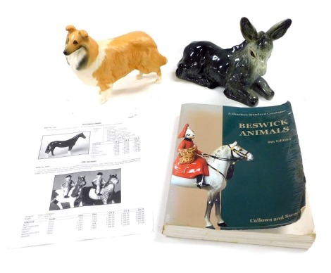 A Beswick pottery figure of a rough collie, Lochinvar of Lady Park, matt glazed, together with a Charlton standard catalogue to Beswick animals, eighth edition, and a pottery figure of a recumbent donkey. (3)