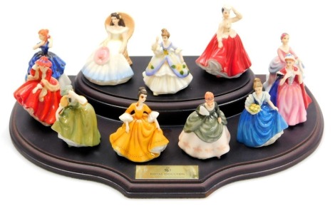 A set of ten Royal Doulton miniature ladies figures, boxed, with stand, and a further figure modelled as Laura.