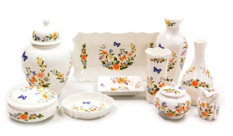 A group of Aynsley Cottage Garden pattern porcelain, including a ginger jar and cover, three vases, figure of an owl, powder box and cover and other dressing table dishes etc. (qty)