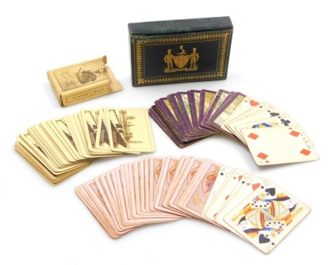 Two packs of early 20thC Worshipful Company of Playing Cards playing cards, contained in a green morocco leather and gilt tooled case, bearing coat of arms and motto for the Worshipful Company of Playing Cards, the case 14cm wide, together with a pack of 