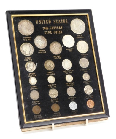 A group of United States 20thC type coins, including a Morgan dollar 1900, a Liberty Peace dollar 1921, half dollars, quarter dollars and various cents, framed and glazed.