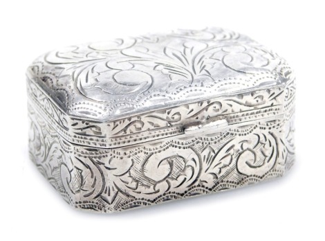 A silver pill box, of canted, rectangular form, with engraved foliate decoration, 0.65oz.