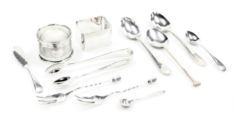 A pair of George V silver sugar tongs, Birmingham 1931, two silver napkin rings, a butter knife, pair of Edward VII Scottish silver teaspoons, initial engraved, Glasgow 1902, salt spoon, two pickle forks with a thistle terminal and a George V silver seal 