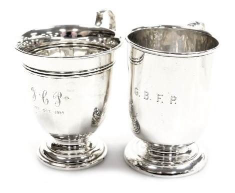 An Edward VII silver christening tankard, initial engraved, Birmingham 1906, and a George V silver christening tankard, of faceted footed form, initial engraved and dated 1934, Birmingham 1932, 4.53oz.