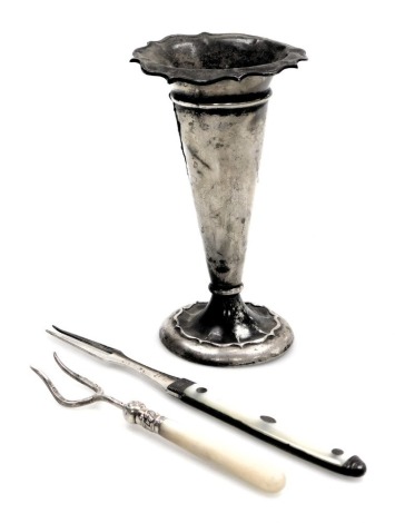 A George III silver folding pocket fork, mother of pearl bound, cased, plated pickle fork with mother of pearl handle, and a George V silver vase, of trumpet form, Birmingham 1919, 1.04oz. (3)