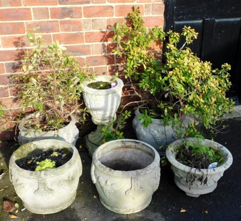 Six reconstituted stone planters, comprising two pairs and two singles.