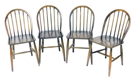 A set of four Ercol dark elm Windsor dining chairs.