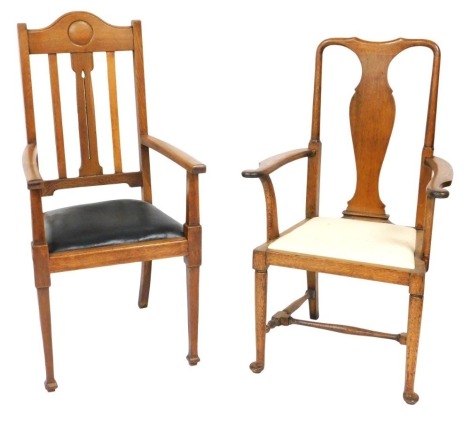 A Victorian Art Nouveau oak carver chair, with a green leather seat, raised on tapering square legs and spade feet, 58cm wide, and a further Queen Anne style oak carver chair with a vase shaped splat and drop in seat, raised on turned legs united by a tur