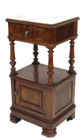 A late 19thC French walnut and marble topped night stand, with a single frieze drawer, raised on turned columns, above a cupboard door, raised on bracket feet, 91cm high, 45cm wide, 37.5cm deep.