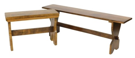 A 20thC oak trestle bench, 127cm wide, and a trestle stool, 67cm wide. (2)