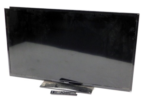 A Panasonic 50" LCD TV, model number TX-50A300B, with remote.