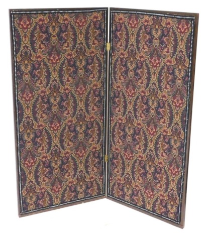 An early 20thC mahogany and fabric panelled two fold screen, 135cm high, 64cm wide, 128 cm extended.