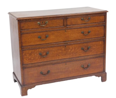 A George III oak and mahogany cross banded chest, of two short over three long graduated drawers, raised on bracket feet, 94cm high, 116cm wide, 53cm deep.