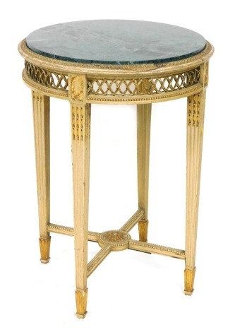 A late 19thC Louis XVI circular parcel gilt and cream painted gueridon, with green marble top, above a pierced gallery, raised on channelled tapering square legs united by a x frame stretcher, 78cm high, 58cm diameter.