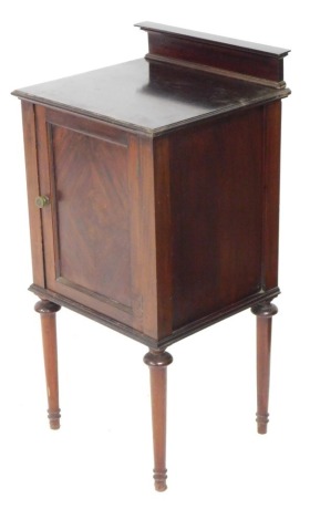 A Victorian mahogany pot cupboard, with a quarter veneered door, enclosing a single shelf, raised on turned legs 82cm high, 40cm wide, 36cm deep,