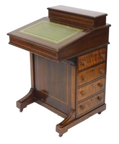 A Victorian mahogany davenport, with satinwood crossbanding, having a fitted box top and gilt tooled green leather slope, opening to reveal three recesses above four drawers and four dummy drawers, raised on a plinth base, on castors, 84cm high, 55cm wide