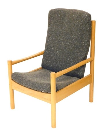 An Ercol light ash armchair, with brown cushion seat and back, raised on turned legs, 60.5cm wide.