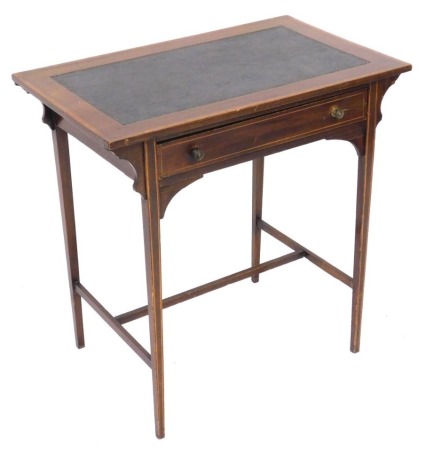 An Edwardian mahogany and satinwood crossbanded writing table, with a tooled leather top, above a frieze drawer, raised on tapering slender square legs united by a H framed stretcher, 70cm high, 71cm wide, 44cm deep.