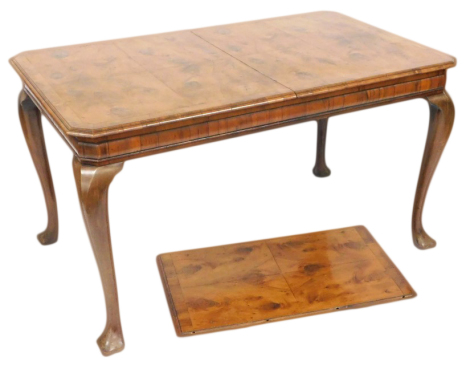 A 19thC yew wood and mahogany draw leaf dining table, with one additional leaf, with a burr wood quarter veneered top, raised on cabriole legs, 76cm high, 136cm wide, 182cm extended, 83cm deep.