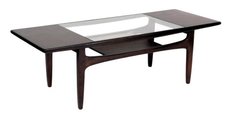 A G Plan dark teak coffee table, the rectangular top set centrally with a rectangular glass plate, raised on turned legs, united by stretchers and an under tier, 42.5cm high, 137cm wide, 51cm deep.