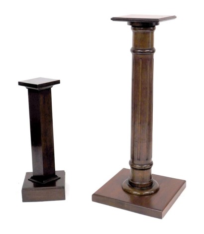 An early 20thC mahogany jardiniere stand, raised on a turned column and square base, 109cm high, and another stand, with a square column, 70cm high. (2)