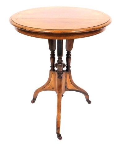 A Victorian rosewood and inlaid occasional table, by S & H Jewell, 30/31 Little Queen Street, Holborn, W.C., the circular top with inlaid boxwood and ivory floral and foliate decoration, raised on three outswept and turned columns, above a central finial 