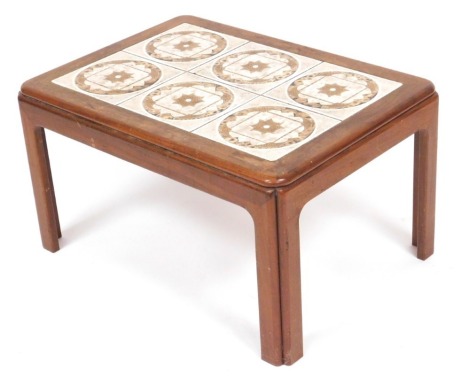 A G-Plan teak and tile top coffee table, inset with six brown floral tiles, raised on straight legs, 40cm high, 72cm wide, 52cm deep.