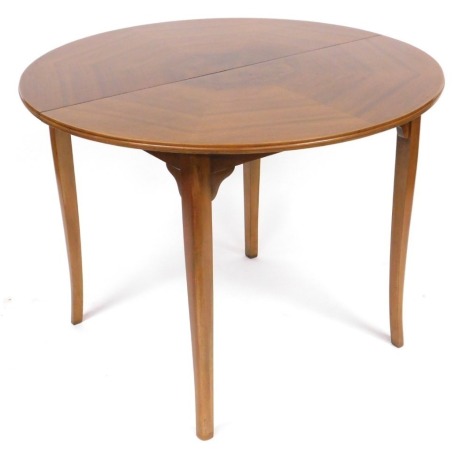 A Strongbow walnut demi lune fold-over tea table, raised on outswept legs, 78.5cm high, 100cm wide, 50cm deep.