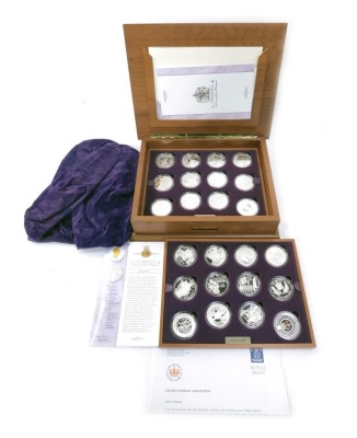 A Royal Mint The Queen's Golden Jubilee 2002 silver proof coin set, containing twenty four coins, some with 22ct gold and enamel decoration, contained in a fitted case with various certificates of authenticity, each coin approx 28.28g.