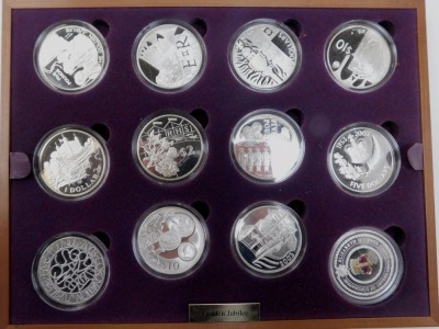 A Royal Mint The Queen's Golden Jubilee 2002 silver proof coin set, containing twenty four coins, some with 22ct gold and enamel decoration, contained in a fitted case with various certificates of authenticity, each coin approx 28.28g. - 2