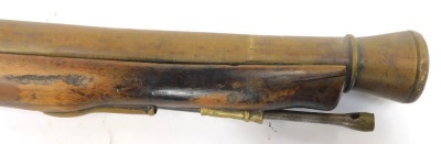 An 18thC flintlock blunderbuss by Barnett of London, with brass barrel, steel ram rod, brass trigger guard and furniture, stamped Barnett London, walnut stock, 87cm long overall. - 3