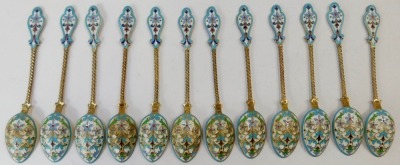 A set of twelve early 20thC Russian silver gilt and enamel coffee spoons, each with a shaped top, on twist stem with cream and blue floral enamel back, white metal stamped 88 fineness, 6oz. - 3