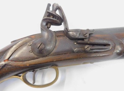 A replica flintlock holster pistol, with wooden and brass ramrod, and brass furniture, numbered 4844, 49cm long. - 2