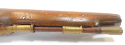 A replica flintlock holster pistol, with wooden and brass ramrod, and brass furniture, numbered 4844, 49cm long. - 4