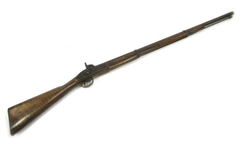 An Enfield Tower 1857 pattern percussion musket, with ramrod, and walnut stock, bearing stamp 1857 Tower with a crown and VR, 126cm long overall.