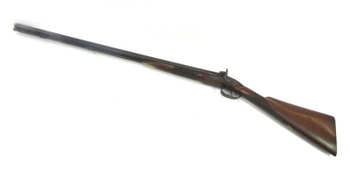 A 19thC hammer action twin barrel sporting gun, for CJ Thomsett, muzzle loading, with wooden ramrod, with brass furniture, walnut stock, stamped CJ Thomsett London, 121cm long overall.