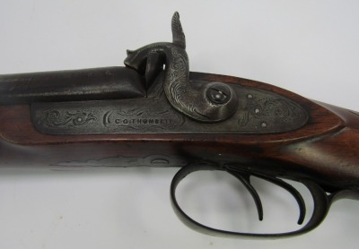 A 19thC hammer action twin barrel sporting gun, for CJ Thomsett, muzzle loading, with wooden ramrod, with brass furniture, walnut stock, stamped CJ Thomsett London, 121cm long overall. - 2
