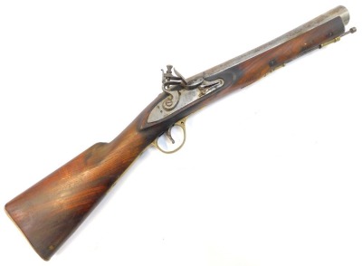 A flintlock blunderbuss, with steel barrel, indistinctly stamped, steel ramrod with brass mounts, elm stock, 64cm long overall.