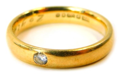 A 9ct gold diamond solitaire wedding band, set with a tiny diamond, inscribed 26 Years, ring size M½, 3.1g all in.